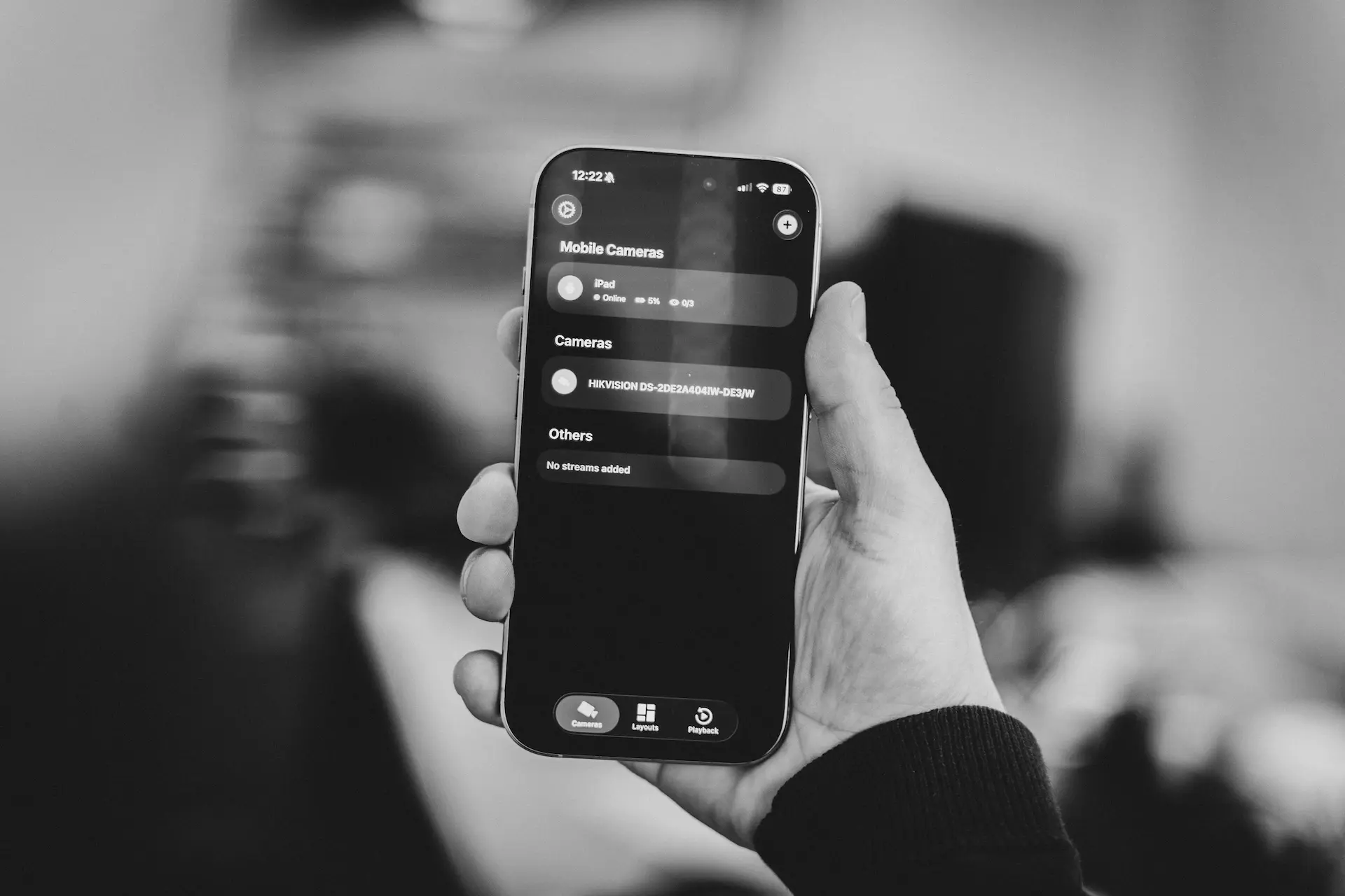 UniCam Mobile app monitoring IP cameras on iOS and Android devices